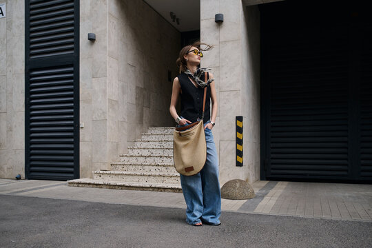 woman walking in the street, street style fashion.