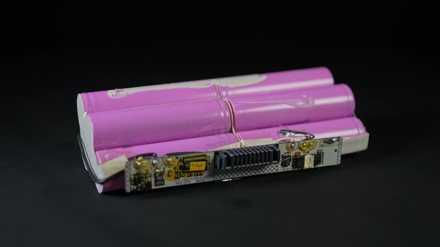 Batteries AA type on black background as an example of rare earths metals use in smart devices, electric vehicles and are hard to mine and separate cleanly 