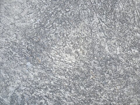 Gray rough concrete wall texture background with weathered grunge surface pattern