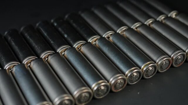 Battery cells extracted from inside assembly of high tech modules. Such as EV electric vehicles, electric e-bikes and computers cordless power parts. Energy storage and tech power.