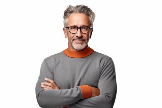 Mature man with grey hair and beard wearing glasses, arms crossed, looking at camera