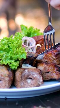 Traditional Churrasco Brazilian Barbecue. Picanha being hand picked from platter. Home Grill from Brazil . High quality 4k footage