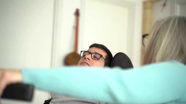 Mother and disabled son taking a selfie together