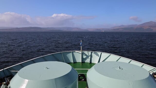 A Scottish ferry makes it way across the Firth of Clyde to Brodick on the Isle of Arran. The Ferry goes from Ardrossan in Ayrshire.