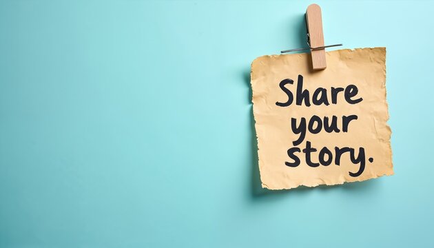 Paper note with text Share your story hangs on blue background. Wooden clip holds torn parchment with handwritten message. Invitation to tell personal tales and life events.