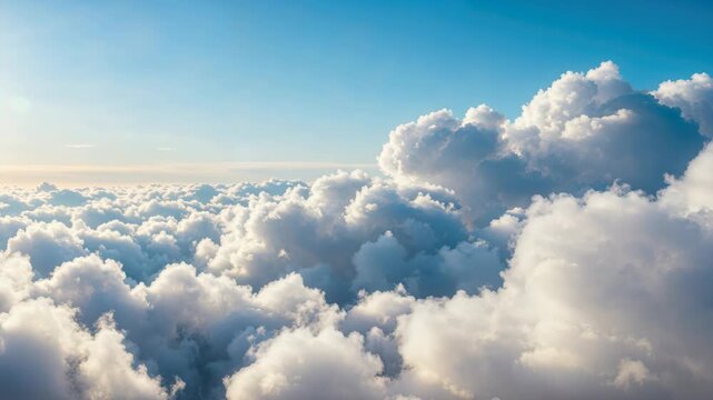 Sky's Embrace: Witness the ethereal beauty of a vast, cloud-filled sky, where soft, fluffy formations drift lazily, creating a sense of peace and endless possibility.