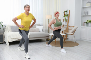 Obraz premium Senior women training at home. Fitness and sport
