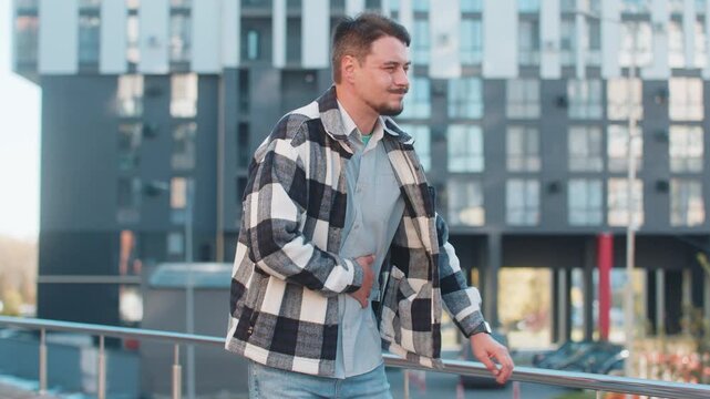 Caucasian mature man traveler feeling sudden strong abdominal stomach ache gastritis problem. Upset tourist guy having symptom poisoning diarrhea indigestion peptic ulcer pancreatitis on city street.