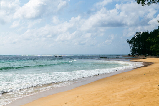 Golden sand and turquoise shoreline at Nai Yang Beach Phuket Thailand