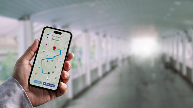 hand holding smartphone showing gps navigation map for route planning, mobile app tracking, location search, delivery logistics management, travel navigation, and business optimization for real-time d