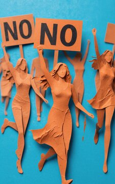 Paper cutout women protest with "NO" signs defiant and united against
