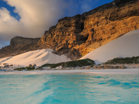 Sand dunes and cliffs of Socotra Island at sunset with copy space