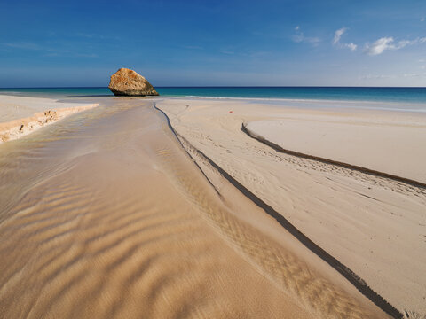 Arher Beach sand patterns and rock Socotra island Yemen copy space