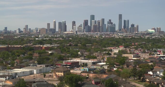 Establishing aerial shot of South Houston urban sprawl with downtown Houston in the background