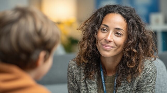 Court-appointed Guardian Ad Litem Speaks With Child in a Warm Interview Room for Custody and Protective Legal Services