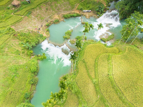 Waikacura waterfall looks beautiful when the water is abundant at the end of the rainy season, surrounded by rice fields where the rice is starting to turn yellow