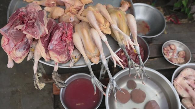 Whole Plucked Chickens Vietnamese Street Market Row Of Skinned Birds With Legs Tied And Bowls Of Dark Blood, Metal Trays And Offcuts On Pavement Stall, Soup Maker Selecting Stock, Rustic