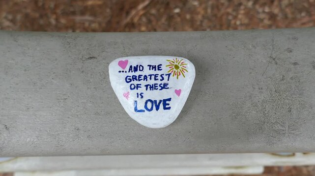 And the greatest of these is love kindness rock swinging on swing