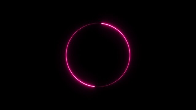 A vibrant pink neon circle glows brightly against a dark background