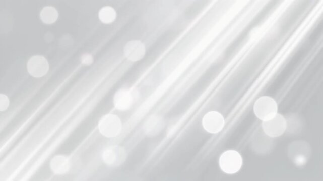 Gray background with white bokeh lights.