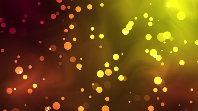A vibrant video showcasing a mesmerizing display of colorful glowing dots in shades of red, orange, and yellow against a dark background, creating a dynamic and captivating visual effect.
