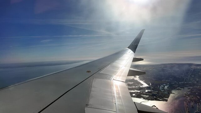 A view out the window of a Scandinavian Airlines aircraft on approach to Copenhagen Airport Kastrup.