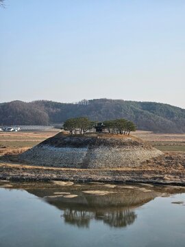 Ancient korean historical site sisadan surrounded by pine trees