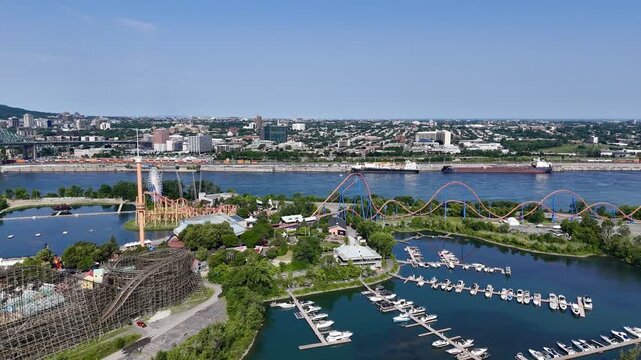 Aerial view of Montreal skyline, Jacques Cartier Bridge and La Ronde amusement island on St Lawrence River. g.