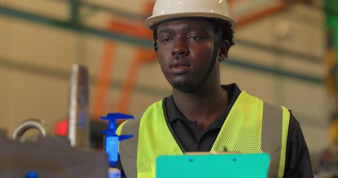 Factory technician uses a vernier caliper to measure a metal component during dimensional inspection in a manufacturing facility, showing quality control, tolerance checks, and process verification.
