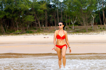 Fototapeta premium Woman with red bikini relax on beach