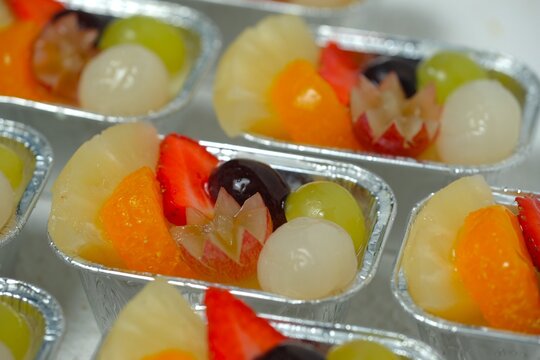Creamy Milk Pudding with Fresh Mixed pineapple, grape, longan, peanch and strawberry garnish