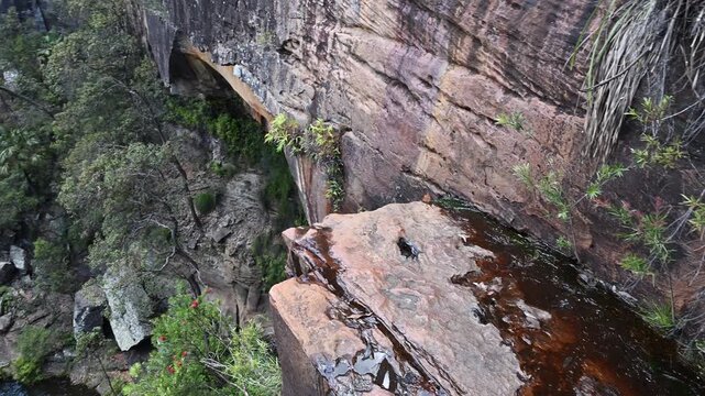 Rainbow Falls Rock pool and cascade waterfall at Blackdown Tablelands, an oasis in the outback and popular travel destination for bush walk and camping in Queensland Australia.