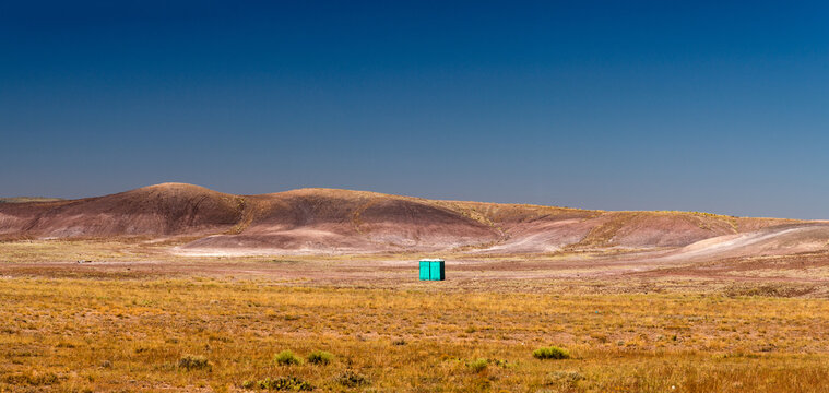 USA, Arizona, St Johns.  Blue portable toilets in the middle of the desert.