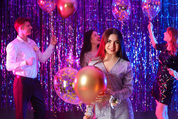 Young woman with balloons on prom night © Pixel-Shot