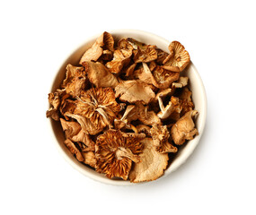 Obraz premium Bowl with dried mushrooms on white background
