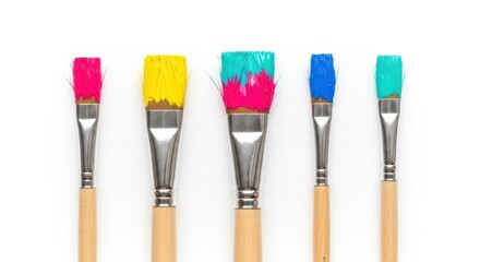 Fototapeta premium Five paint brushes with colorful bristles on white background