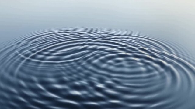 Single drops falling on a lake surface, their ripples intersecting and amplifying each other. The impact of each individual's actions on the collective well-being.