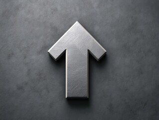 Fototapeta premium Metallic arrow symbol pointing upwards on a textured gray background for design and creative projects visual emphasis