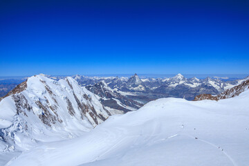 Obraz premium Mountain glacier panorama with summits Lyskamm, Breithorn and Matterhorn (left to right) seen from Signalkuppe in Pennine Alps, Switzerland