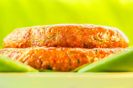 Food Series : Sai Aua, Sai Auo or golden grilled Northern Thai sausage glistens with rich herbal oils on fresh green banana leaves.