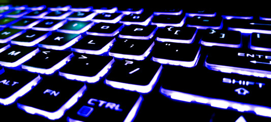 Fototapeta premium computer keyboard with blue button