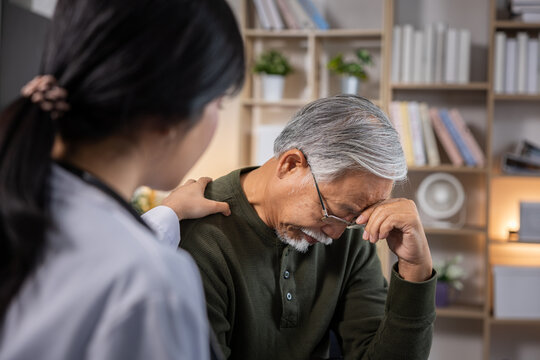 Sad senior man comfort support caregiver mental health depression counseling empathy stress concern clinic healthcare patient doctor nurse consultation bad news worry aging elder family