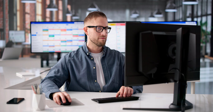 Young Software Developer Strategizes Agile Project Timeline On Computer