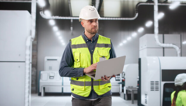 Factory Supervisor Oversees Automated Assembly Line Operations