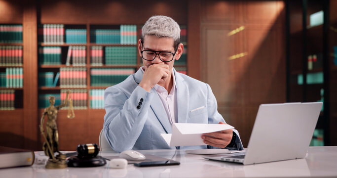 Attorney Reviewing Concerning Letter Regarding Client's Legal
