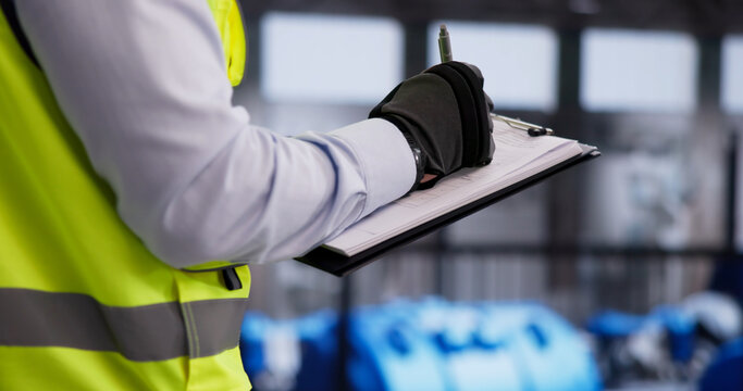 Engineer Wearing Safety Helmet Conducts Detailed Inspection