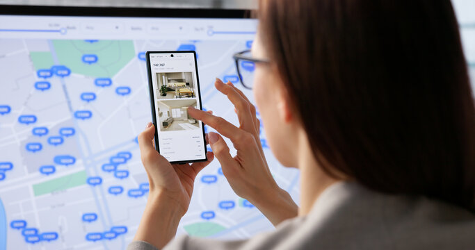 Modern Real Estate Professional Browses Housing Listings Digitally Via Laptop