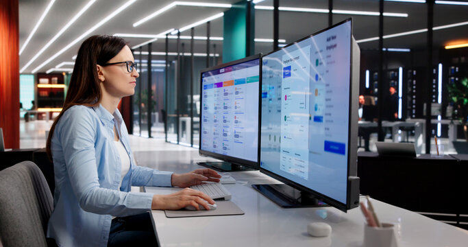 Manager Evaluates Payroll System Updates On Desktop