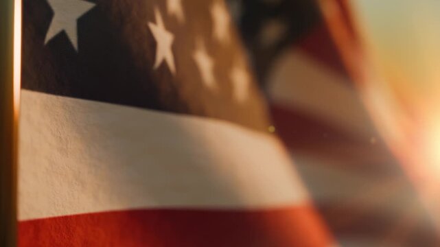 Extreme close-up texture of the stars and stripes on a waving American flag.