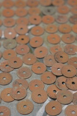 Background Texture of Scattered Vintage Holed Copper Coins © Mas